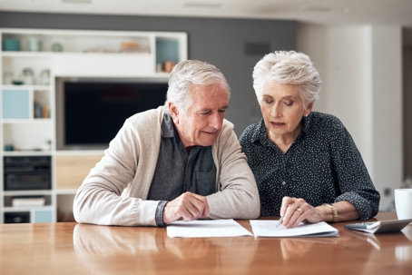 senior couple reviewing documents