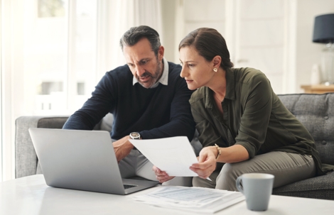 couple reviewing documents at home