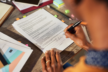 person signing a document