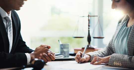 person consulting with a lawyer